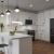 a kitchen with white cabinets