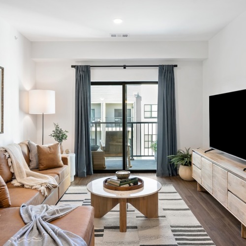 living room with a couch coffee table and tv