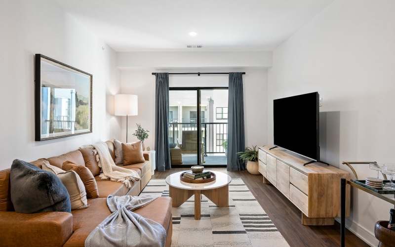 living room with a couch coffee table and tv