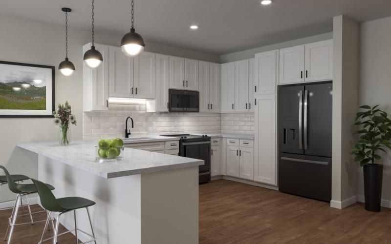 a kitchen with white cabinets