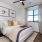 spacious bedroom with bright window
